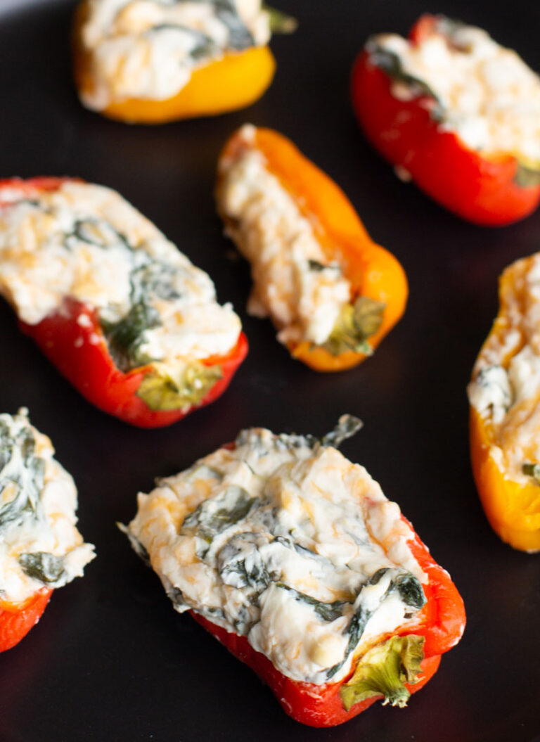 easy stuffed peppers on a plate with cream cheese and spinach