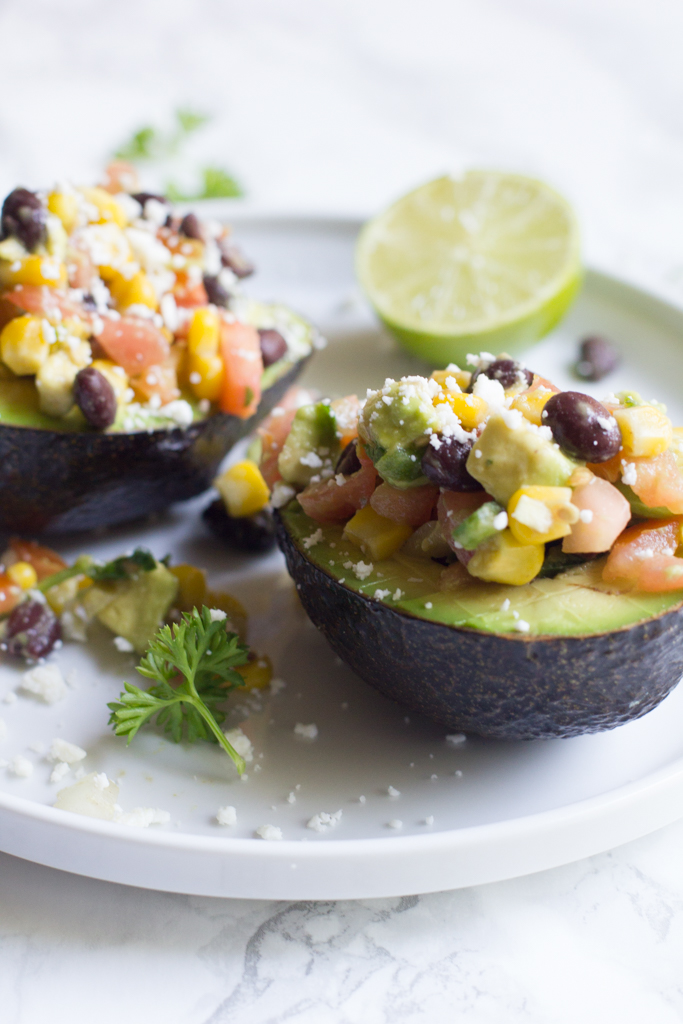 Avocados stuffed with my favorite veggies and beans. The perfect afternoon or post-workout snack.