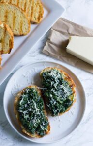 Spinach Asiago Bruschetta. It's the perfect appetizer to any meal and takes only a few minutes to prepare!