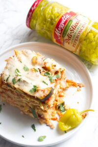 This crock pot vegetable lasagna makes for an easy dinner with bright, fresh, notes of zucchini, squash and peperoncini.