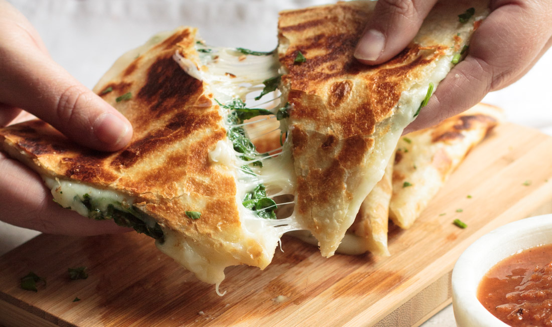 These Spinach Quesadillas are gooey, cheesy and incredibly easy to prepare. From stove to table in less than 5 minutes!