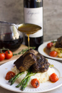 A delicious, decadent and easy dish - this recipe for Slow Cooker Balsamic Braised Short Ribs is excellent for a dinner party or romantic night in. Pair with a glass of your favorite red wine!