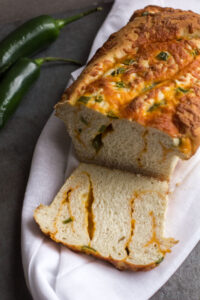 loaf of jalapeno cheese bread on a cloth