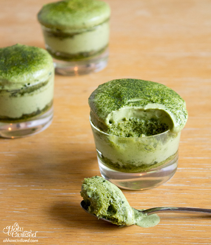 green colored matcha tiramisu in pots on a wooden table