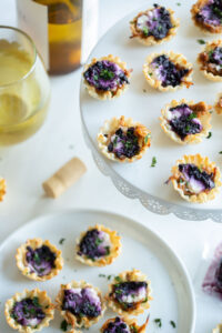 blueberry goat cheese appetizer bites on a serving plate