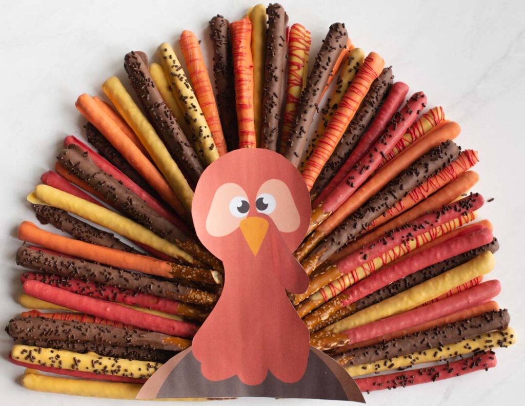 chocolate covered pretzel rods in the shape of a thanksgiving turkey