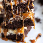 Thick, cakey and delicious Turtle Cheesecake Brownies have a dense, chocolately brownie layer, a sweet cheesecake layer and lots of caramel, chocolate and walnuts or pecans!