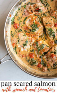Pan seared salmon served in a creamy sauce with garlic, spinach and tomatoes. It's an easy weeknight meal and a delicious seafood dish to serve at your next dinner party!