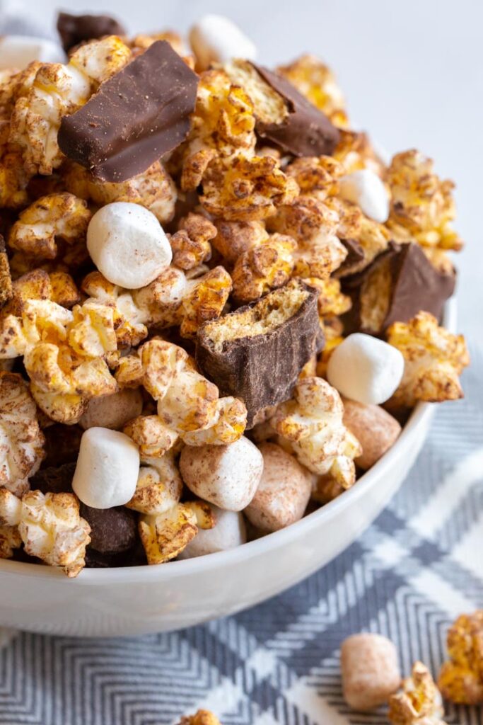 s'mores popcorn with marshmallows and graham crackers in a bowl