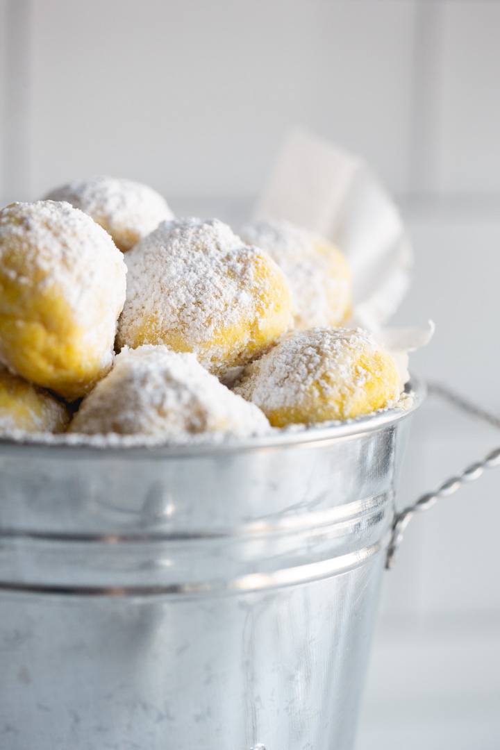 lemon snowball cookies in a tin