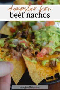These restaurant style beef nachos are a great way to celebrate all trash fires in life: with chips, seasoned beef, cheese, and more, baked easily in cast iron or on a sheet pan in the oven. Top it with a spicy homemade green fire sauce.