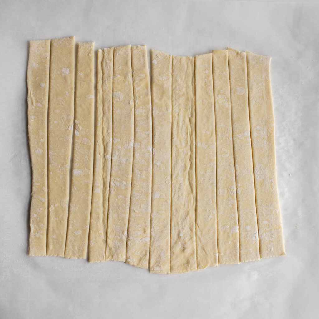 puff pastry rolled out and sliced into strips
