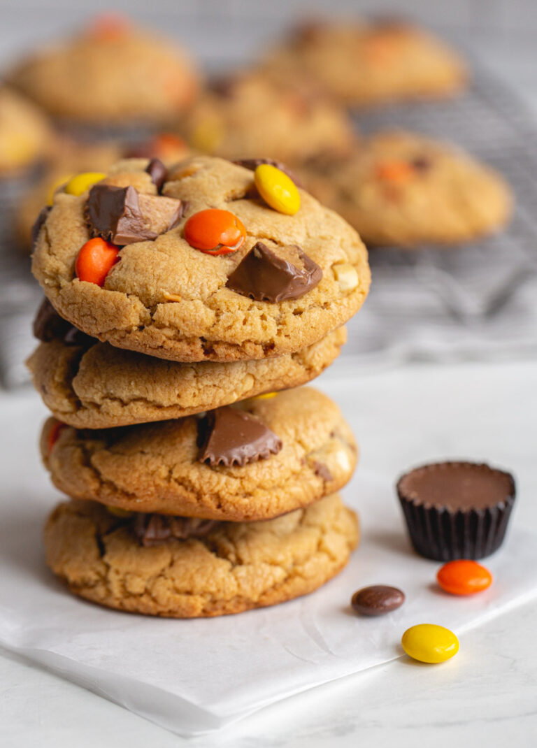 a stack of peanut butter cup cookies with peanut butter candies